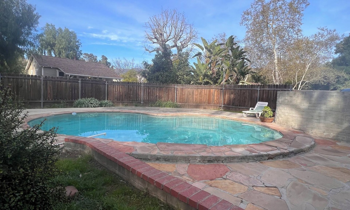 Sunland House | Dog friendly cottage with porch, pool, massive yard, and plenty of parking.