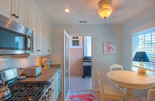 Balboa Peninsula Condo | A beach beauty, this exceptional upper unit is beaming with Balboa beach charm!