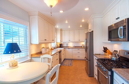 Balboa Peninsula Condo | A beach beauty, this exceptional upper unit is beaming with Balboa beach charm!
