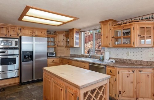 Fawnskin Cabin | Beautiful lakefront estate, hot tub, 180-degree views, game room, and BBQ grill!