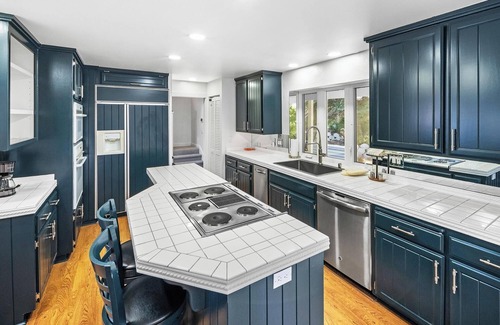 Boulder Bay Cabin | Lakefront Splendor:Spectacular Lakefront Property w/Private Dock! Pool Table + Foosball Table! Spacious Outdoor Deck! Patio & Yard w/Firepit!