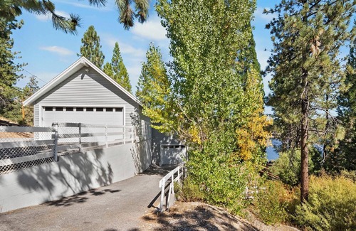 Boulder Bay Cabin | Lakefront Splendor:Spectacular Lakefront Property w/Private Dock! Pool Table + Foosball Table! Spacious Outdoor Deck! Patio & Yard w/Firepit!