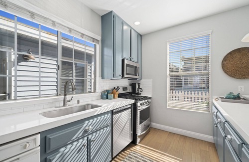 West Newport Condo | Newly renovated Duplex steps to the sand 3bd/3bath