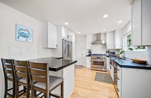 Lantern District House | Stylish beach home near everything with large patio & enclosed yard w/fire pit