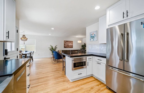 Lantern District House | Stylish beach home near everything with large patio & enclosed yard w/fire pit
