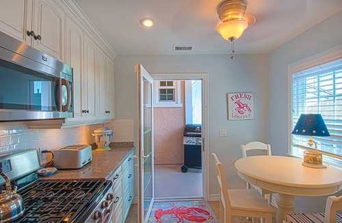 Balboa Peninsula Condo | A beach beauty, this exceptional upper unit is beaming with Balboa beach charm!