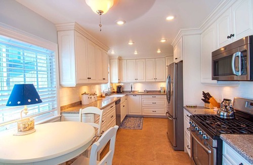 Balboa Peninsula Condo | A beach beauty, this exceptional upper unit is beaming with Balboa beach charm!