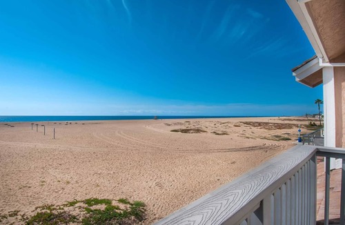 Balboa Peninsula Condo | A beach beauty, this exceptional upper unit is beaming with Balboa beach charm!