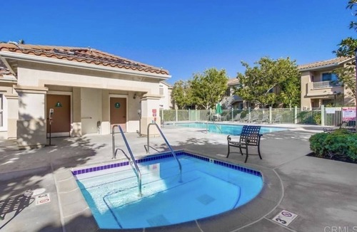 Sabre Springs Condo | A room wt a queen bed and room with 2 twin beds; an attached,interior bathroom.