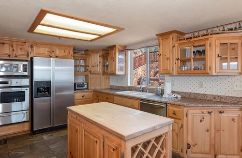 Fawnskin Cabin | Beautiful lakefront estate, hot tub, 180-degree views, game room, and BBQ grill!