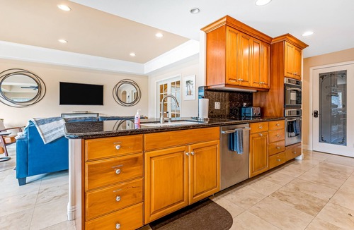 Naples House | Bright home on the channel with expansive patio & elevator