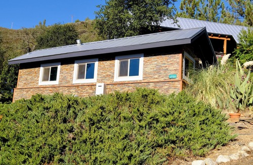 Midpines Cabin | Charming stone clad cabin with views off Highway 140 towards Yosemite