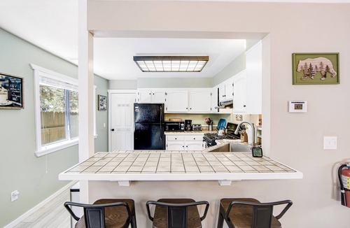 Woodlands Cabin | Classy home with hot tub, tiered decks, firepit, fenced yard & 2 dogs welcome