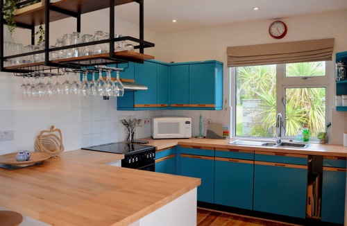 Trebetherick House | Comfortable family house, open plan kitchen/diner, sitting room, wood burner.