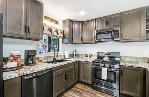 Evergreen Estates Cabin | Cozy 2-bedroom cabin with jacuzzi & fenced in yard! Close to everything!