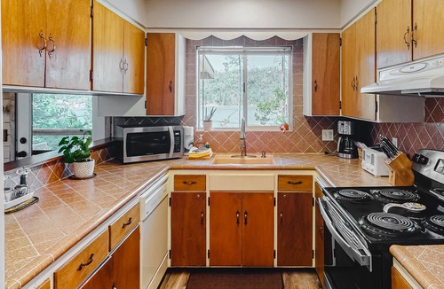 Bass Lake House | Dog-friendly home with boat slip, lake views, multiple decks, yard & WiFi