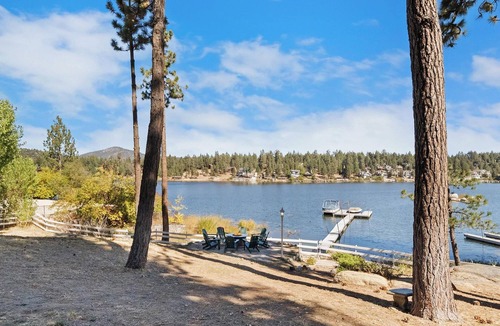 Boulder Bay Cabin | Lakefront Splendor:Spectacular Lakefront Property w/Private Dock! Pool Table + Foosball Table! Spacious Outdoor Deck! Patio & Yard w/Firepit!