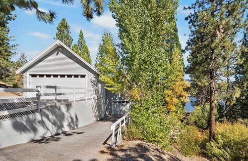 Boulder Bay Cabin | Lakefront Splendor:Spectacular Lakefront Property w/Private Dock! Pool Table + Foosball Table! Spacious Outdoor Deck! Patio & Yard w/Firepit!