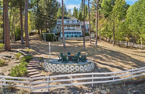 Boulder Bay Cabin | Lakefront Splendor:Spectacular Lakefront Property w/Private Dock! Pool Table + Foosball Table! Spacious Outdoor Deck! Patio & Yard w/Firepit!