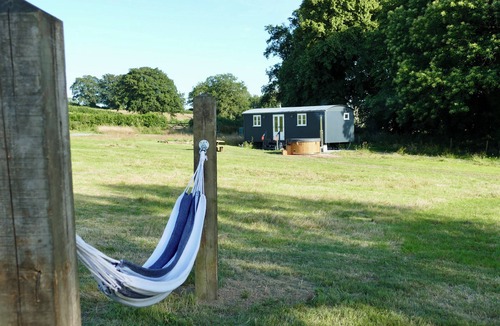 Pentrefelin Cabin | Large luxury shepherd's hut with hot tub in the stunning Welsh countryside.