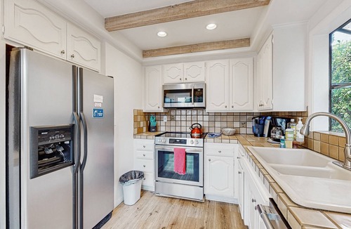 East Beach House | Lovely home with furnished patio, grill & ocean views - close to the beach