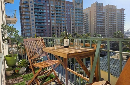 Downtown Long Beach Condo | Luxe Suite one bedroom with free parking, balcony and partial ocean view.