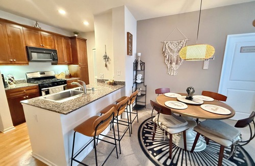 Airport Area Condo | Luxury Artist 2-Bed Condo with Pool View, Private Baths & Modern Amenities