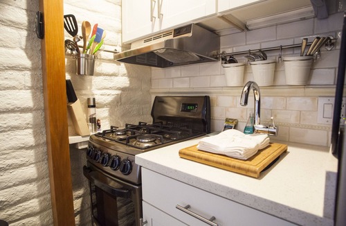 Lantern District Apartment | MicroLux with it All- WiFi, Smart TV, BBQ, W&D, AC, FP, Parking- Close to Beach!