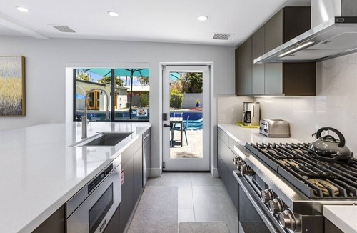 Warm Sands House | Modern Posh – Mid-Century Oasis with Pool, Spa, Game Yard & Mountain Views