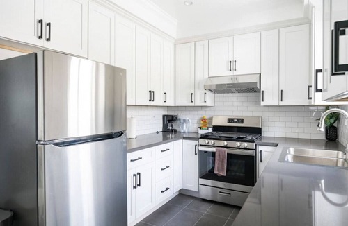 Azusa House | Modern Space Hideaway : w/2 King Beds, 2 Baths, Full Kitchen, a Pull-Out Sofa, with Backyard Patio and Gated Parking.