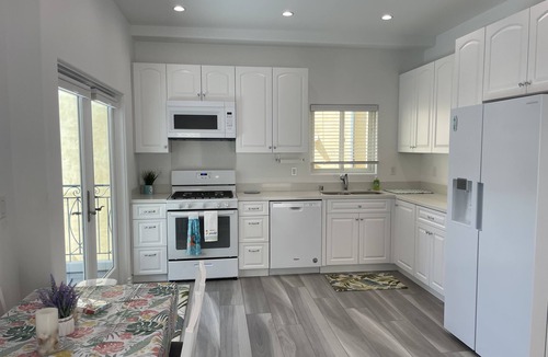 The Strand House | New ocean front duplex, walk to dining, shops & entertainment.