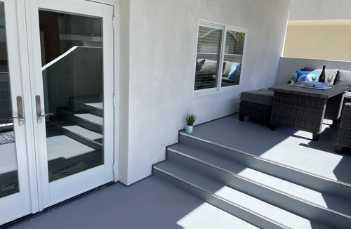 The Strand House | New ocean front duplex, walk to dining, shops & entertainment.