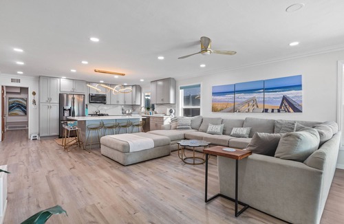 Alamitos Beach House | Oceanfront retreat with rooftop deck, modern interior, marble finishes, & W/D