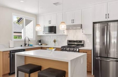 The Plaza House | Ostrom · Modern heated pool&spa + 5 mi to beach