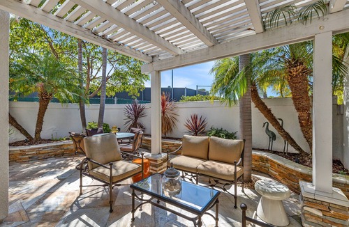 Del Obispo House | Secluded townhome with partial ocean views, patio, gas grill, pool & hot tub