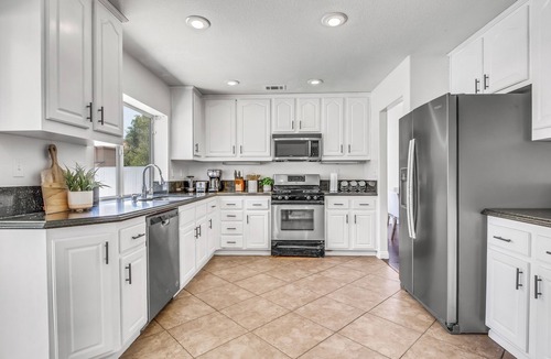 Riverside House | Spacious 5-Bed, 3-Bath Riverside Home with Pool & Jacuzzi