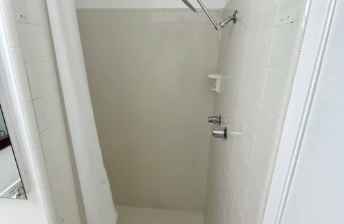Seaside Apartment | Spacious bedroom with private bathroom