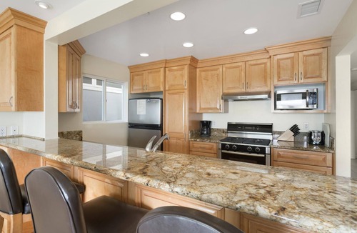 Balboa Peninsula Condo | Stay on the Oceanfront | Coveted Pier-to-Pier Location | Walk to it All (upper level unit)