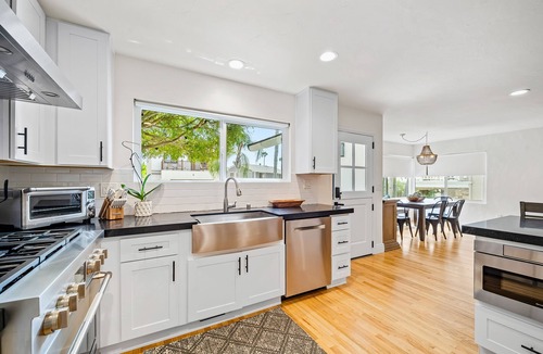Lantern District House | Stylish beach home near everything with large patio & enclosed yard w/fire pit