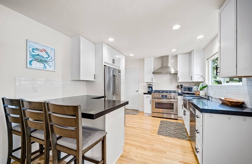Lantern District House | Stylish beach home near everything with large patio & enclosed yard w/fire pit