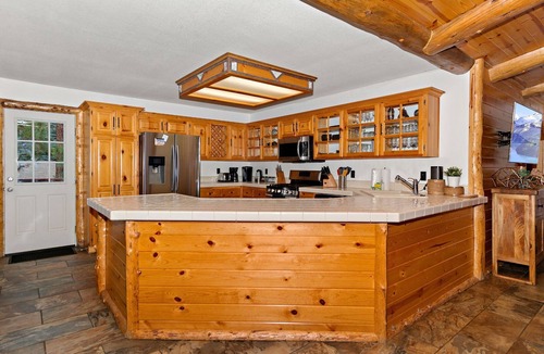 Fox Farm Cabin | The Crazy Bear by Destination Big Bear : Fox Farm! Fenced Backyard! Pet Friendly! Hot Tub! Propane BBQ! Internet! Mountain Decor!
