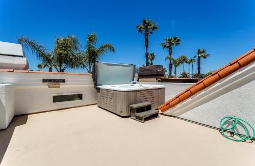 Huntington Beach House | The White House with spa, bikes and steps to the beach and down town main street shops and dining