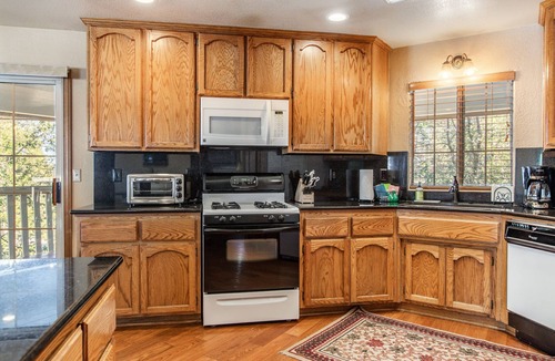 Upper Moonridge House | Updated home with spa, pool and ping-pong tables, king suite, bunk room + more!