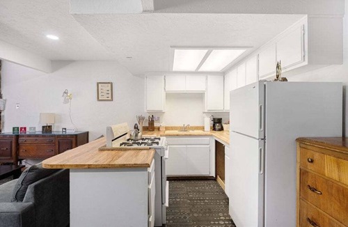 The Village Hotel | Village Suites Inn. Brown Bear, Perfect Location in the Village, fully equipped upstairs unit.
