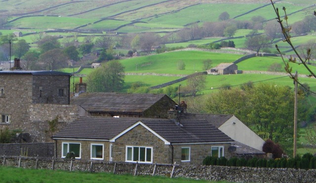 Single storey detached cottage with enclosed gardens and spectacular views.