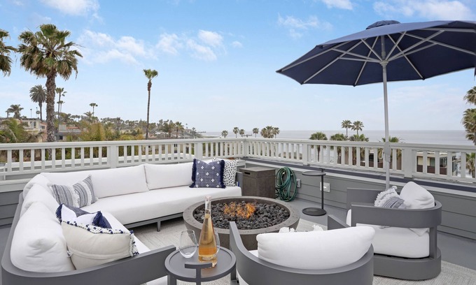 Beach Barber Tract House | Designer Luxury Coastal Home with Panoramic Ocean Views, Rooftop Deck, & Fire Pit