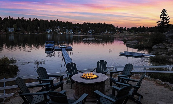 Boulder Bay Cabin | Lakefront Splendor:Spectacular Lakefront Property w/Private Dock! Pool Table + Foosball Table! Spacious Outdoor Deck! Patio & Yard w/Firepit!
