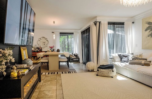 Lake Forest Condo | A Spacious room with artistic design and a bidet in the forest.